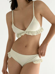 Swimsuit with ruffles, milky