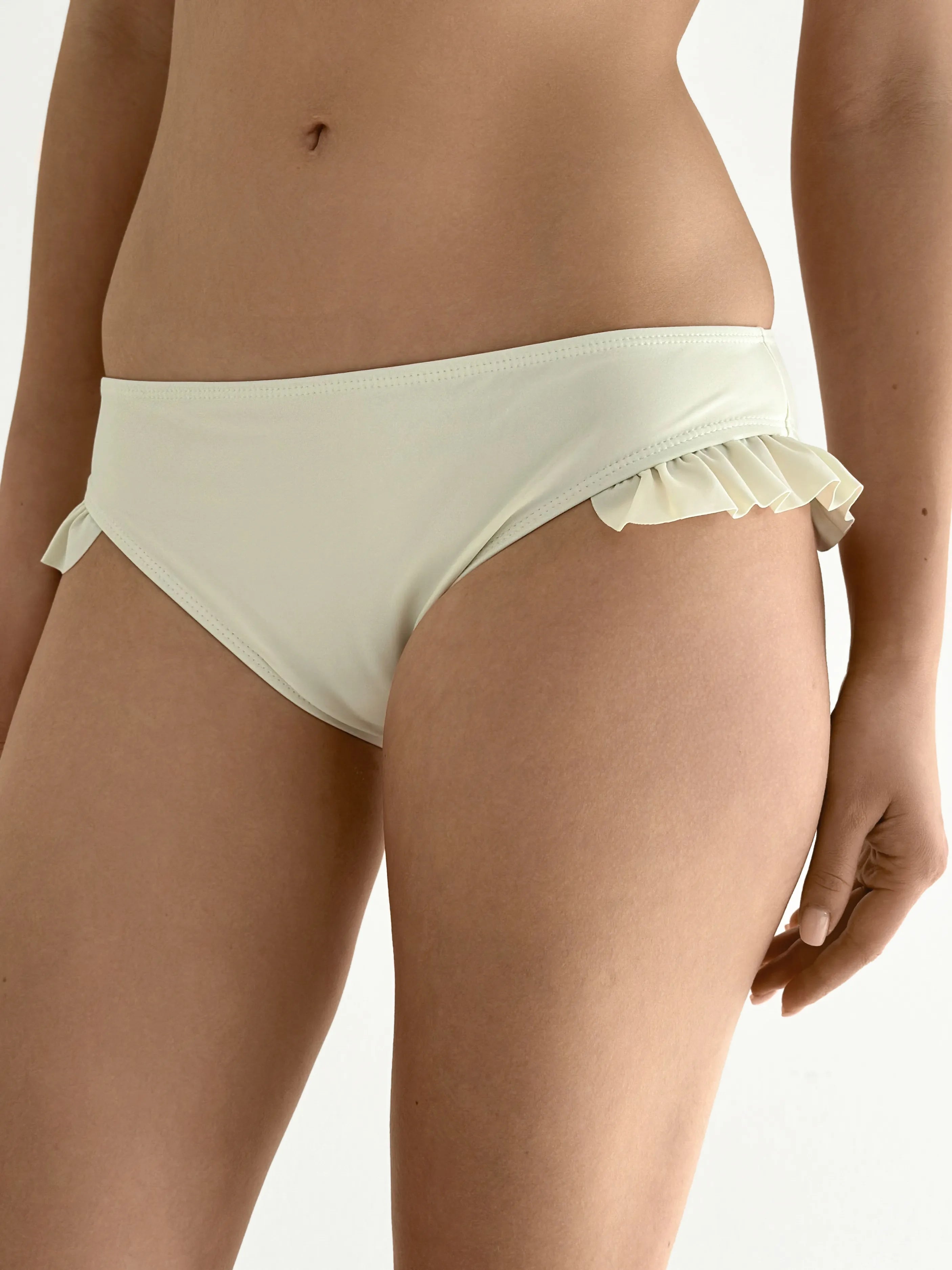 Swimsuit with ruffles, milky