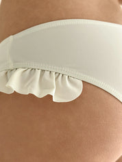 Swimsuit with ruffles, milky