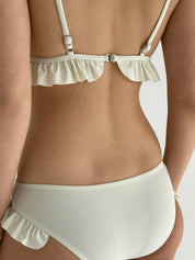 Swimsuit with ruffles, milky
