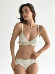 Swimsuit with ruffles, milky