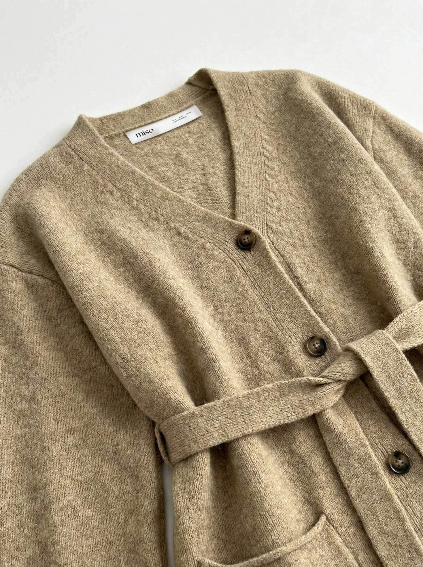 Set knitted cardigan with belt and beige pants