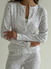 Set of long-sleeved shirts with buttons and ribbed pants, small pink flower on white