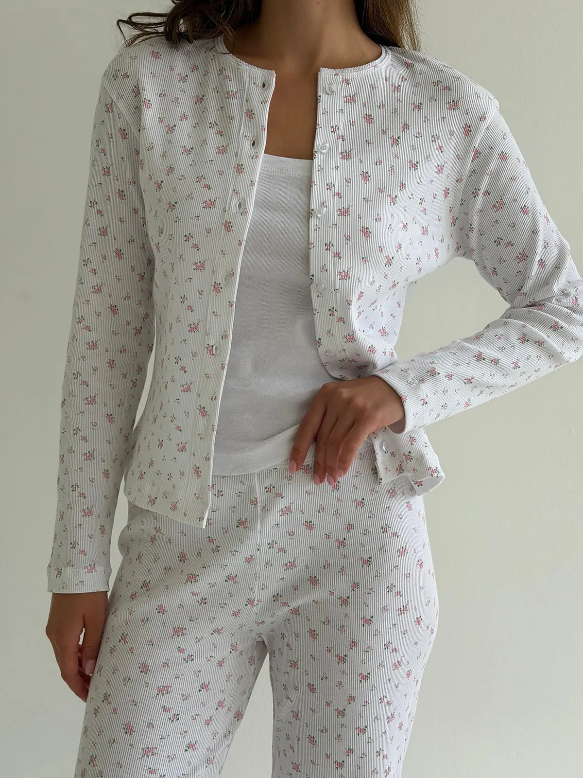Set of long-sleeved shirts with buttons and ribbed pants, small pink flower on white