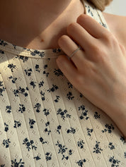 Ribbed T-shirt milk color with a blue flower
