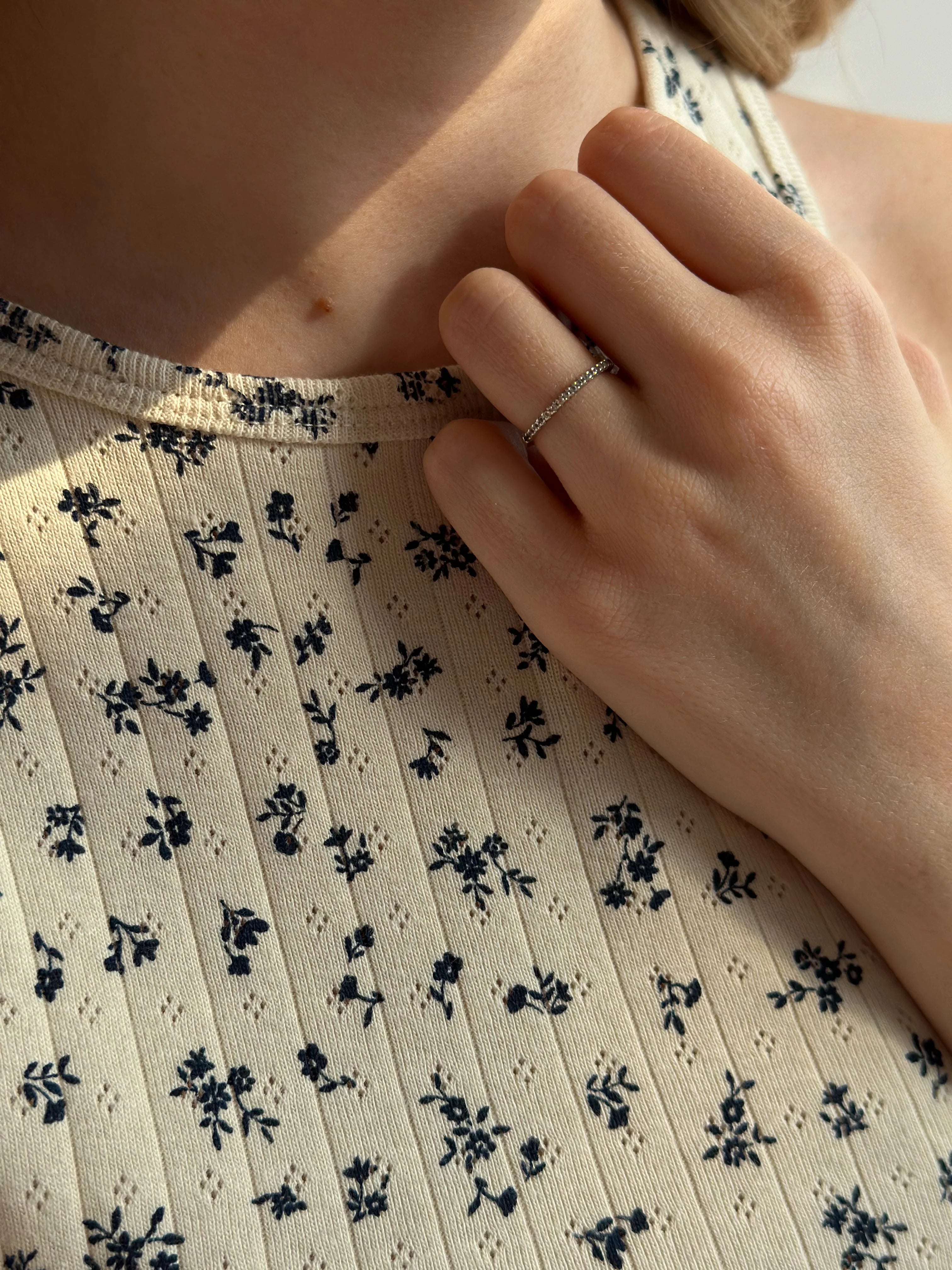 Ribbed T-shirt milk color with a blue flower