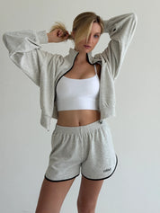 Velour sports suit with zip-up jacket and striped shorts, milk melange