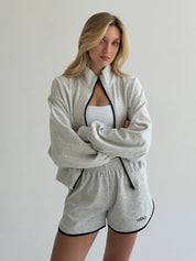 Velour sports suit with zip-up jacket and striped shorts, milk melange