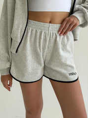 Velour sports suit with zip-up jacket and striped shorts, milk melange