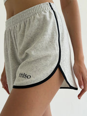 Velour sports suit with zip-up jacket and striped shorts, milk melange