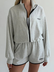 Velour sports suit with zip-up jacket and striped shorts, milk melange