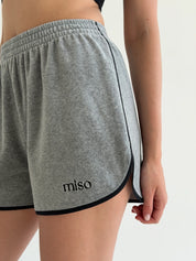 Velour sports suit with zip-up jacket and striped shorts, grey melange