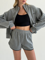 Velour sports suit with zip-up jacket and striped shorts, grey melange