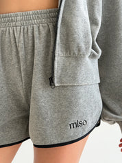 Velour sports suit with zip-up jacket and striped shorts, grey melange