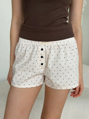 Satin shorts, small black polka dots on pale pink