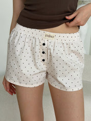 Satin shorts, small black polka dots on pale pink
