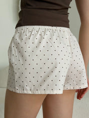 Satin shorts, small black polka dots on pale pink