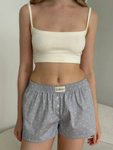 Satin shorts, small polka dots, white on gray