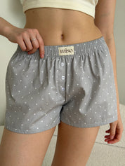 Satin shorts, small polka dots, white on gray