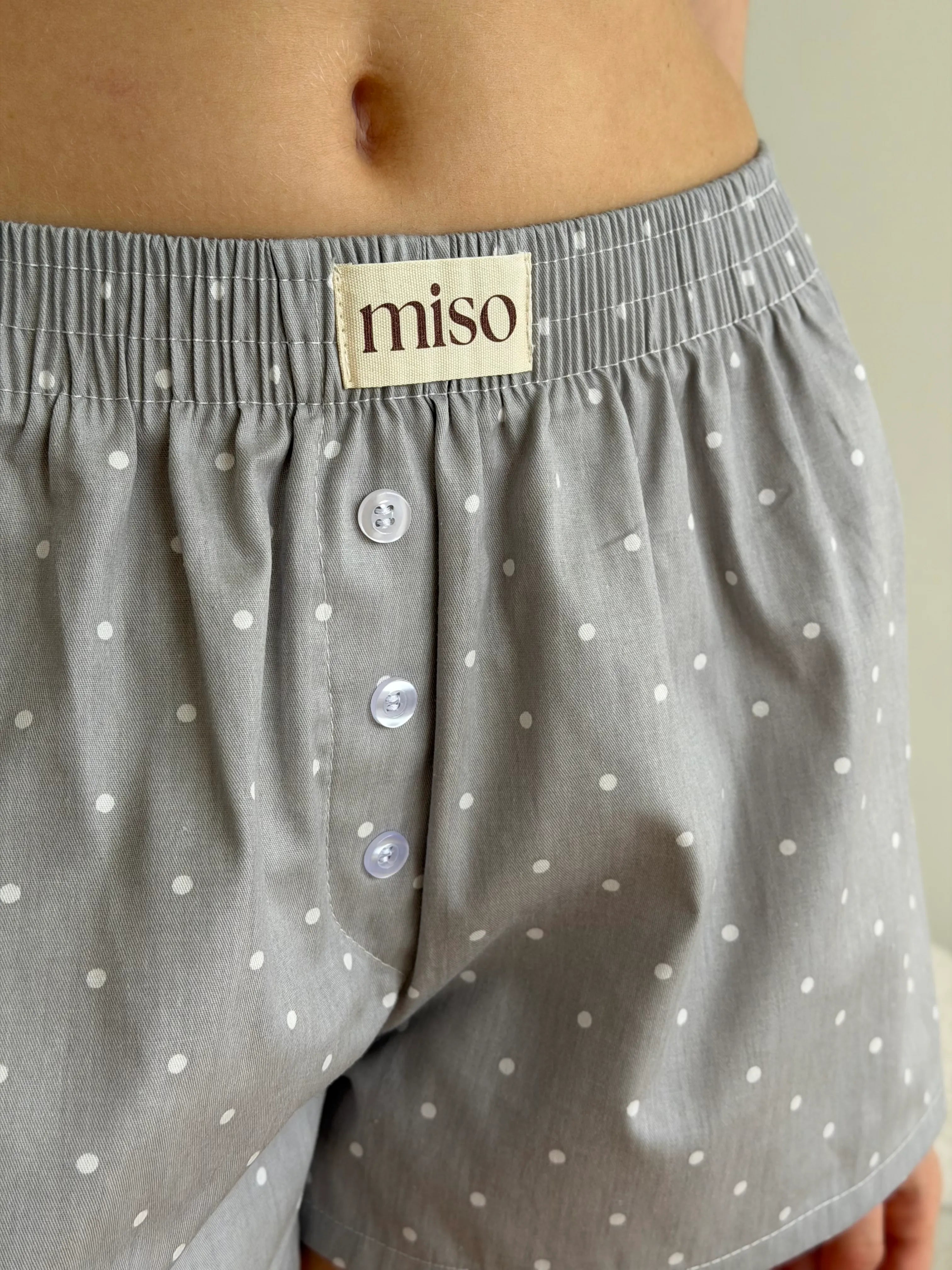 Satin shorts, small polka dots, white on gray