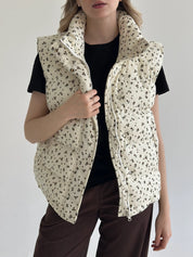 Quilted puffed velvet vest in milky color with flower, onesize