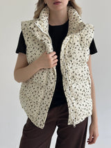 Quilted puffed velvet vest in milky color with flower, onesize