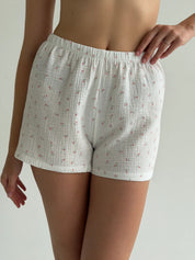 Long sleeve shirt and muslin tulip shorts suit on white