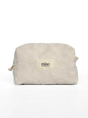 Medium jacquard terry cosmetic bag with flowers, milky color