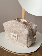 Medium jacquard terry cosmetic bag with flowers, beige color