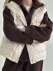 Quilted puffy vest in milky pink flower