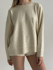Knitted milky sweater with a blue flower