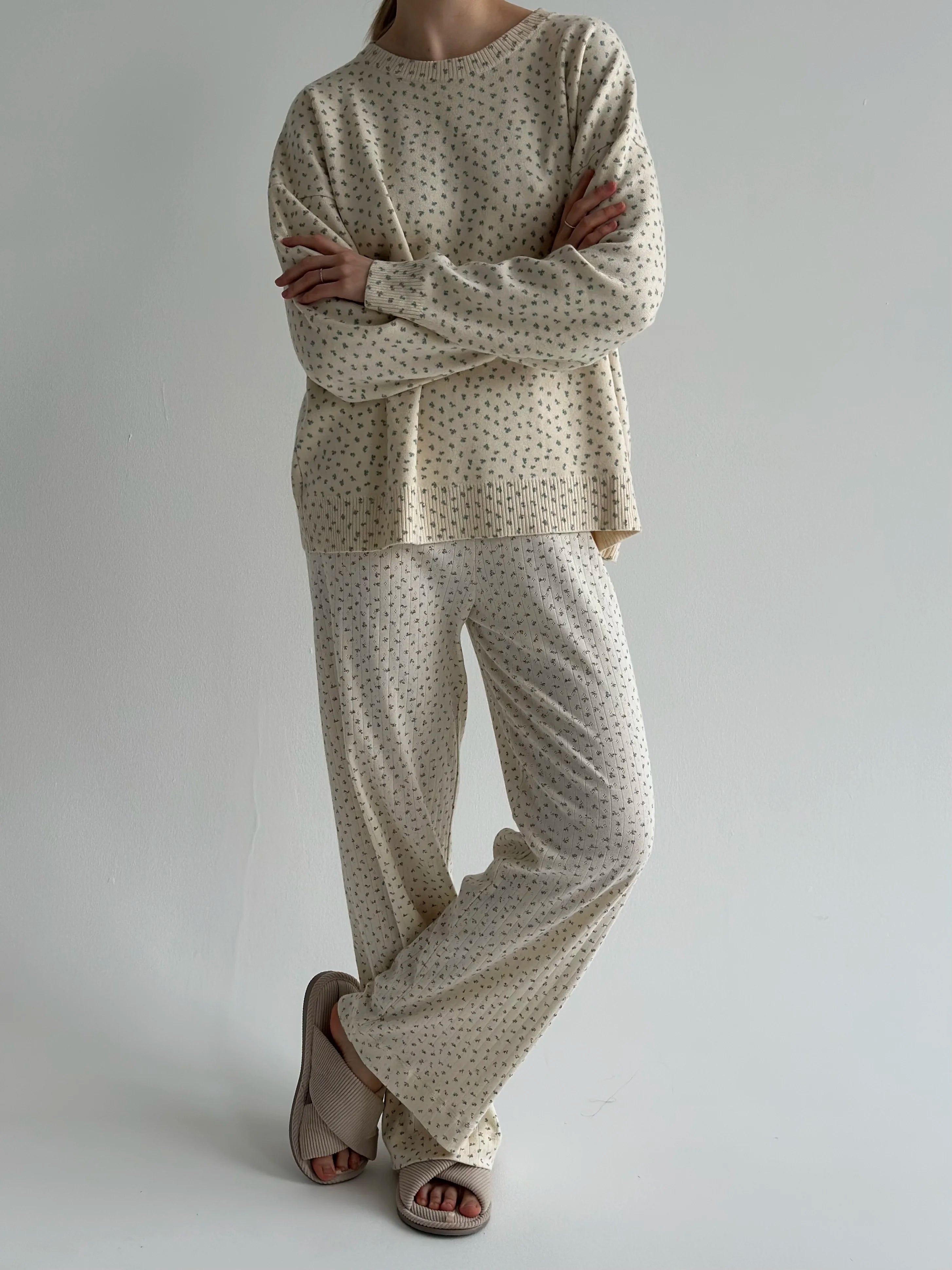 Knitted milky sweater with a blue flower