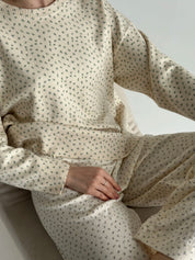 Knitted milky sweater with a blue flower