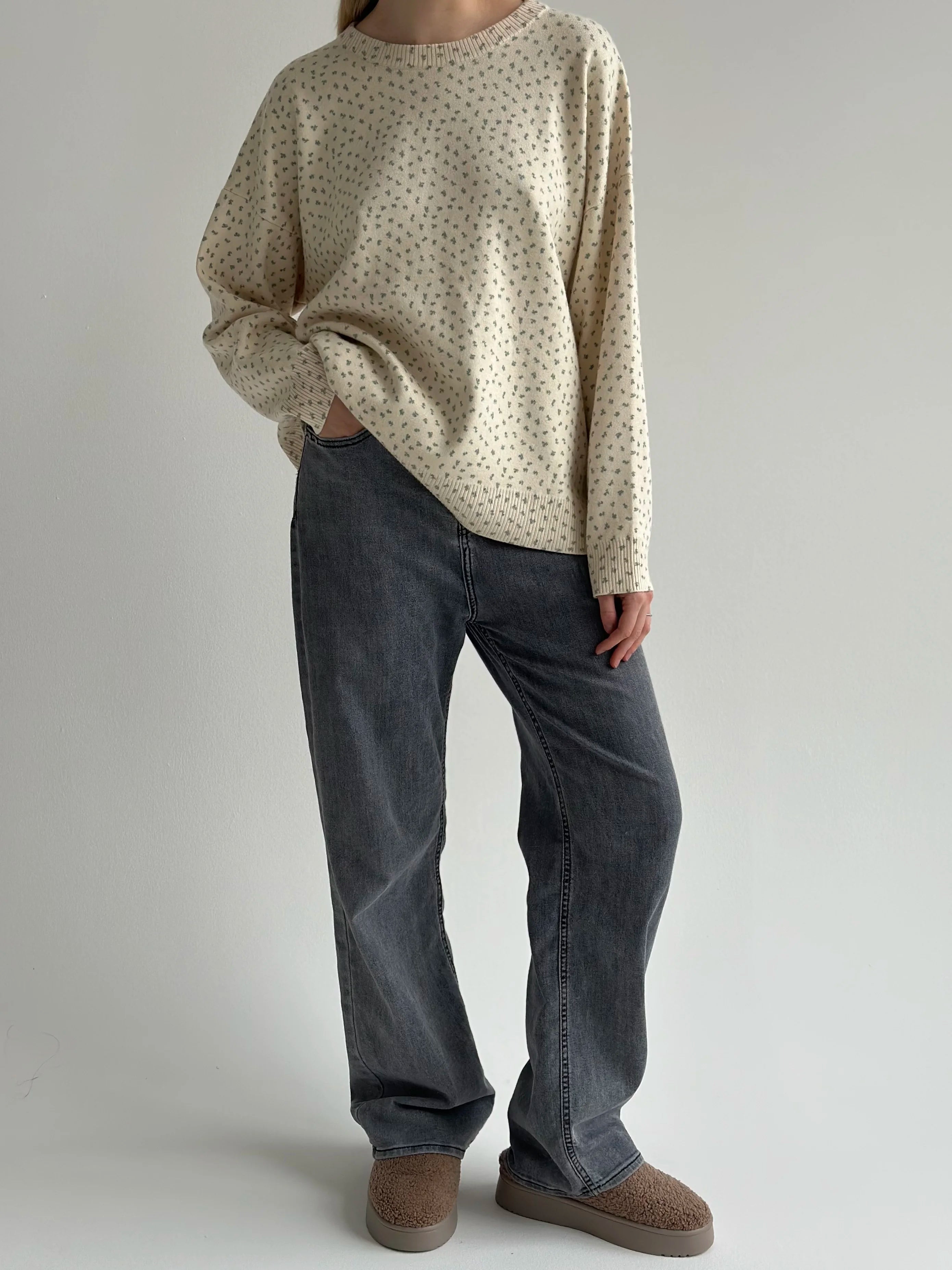Knitted milky sweater with a blue flower