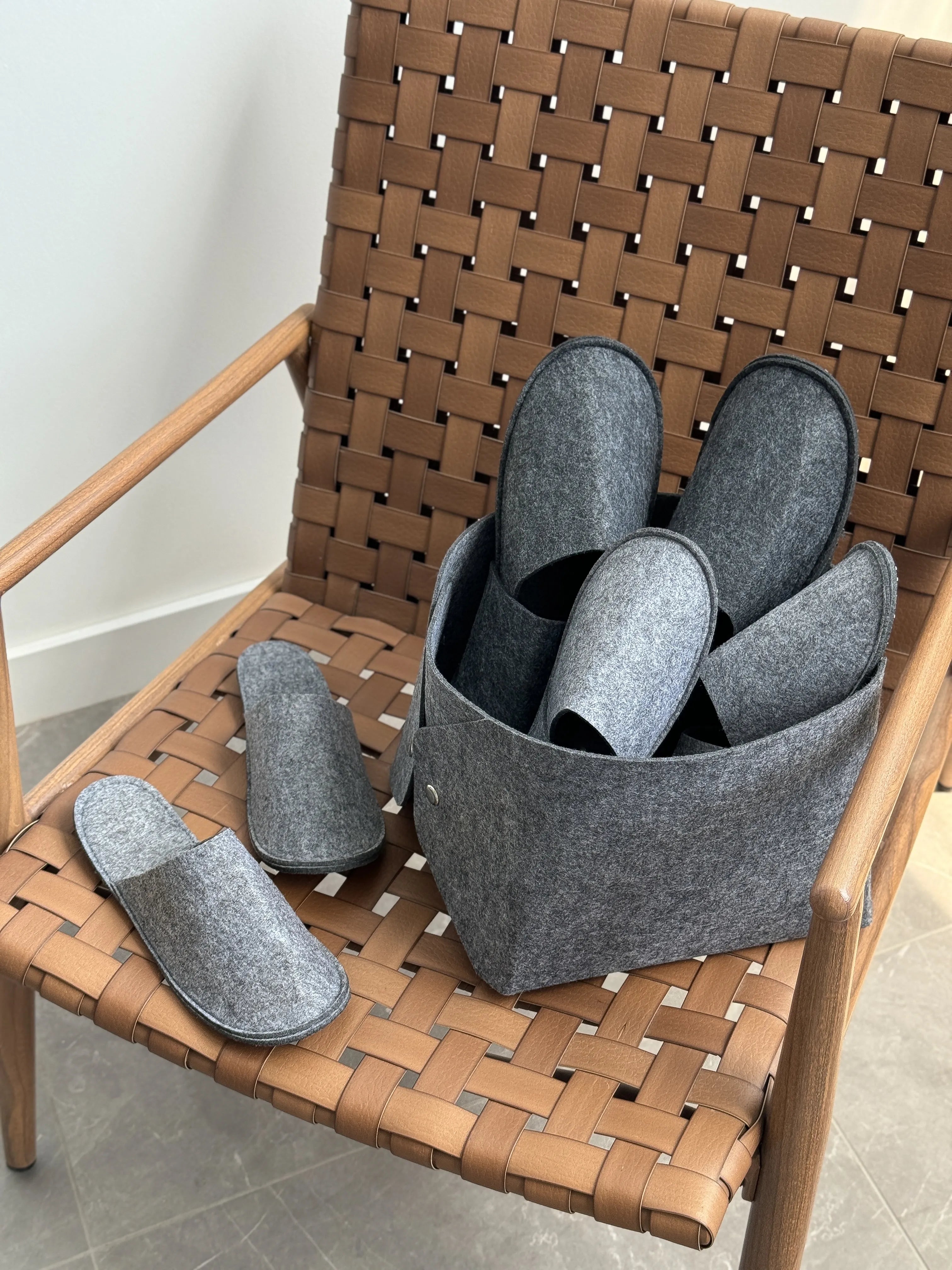 Set of guest slippers and basket