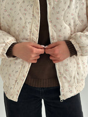 Quilted demi-season jacket, milky white with pink flower