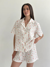 Shorts and short-sleeved muslin flower shirt suit on white