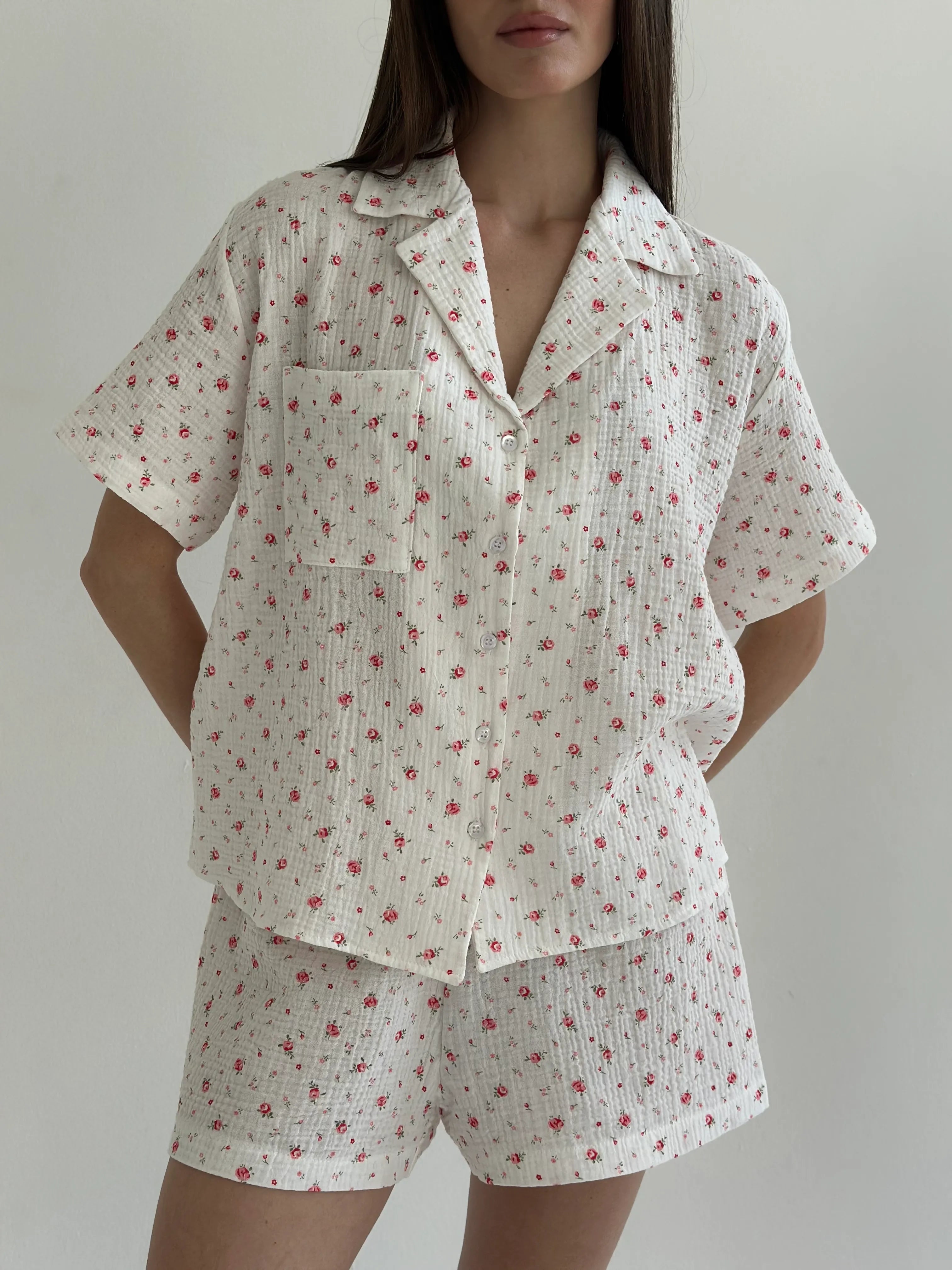 Shorts and short-sleeved muslin flower shirt suit on white