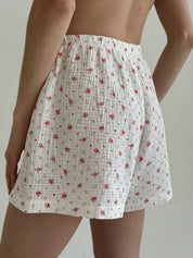 Shorts and short-sleeved muslin flower shirt suit on white