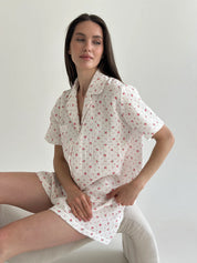 Shorts and short-sleeved muslin flower shirt suit on white