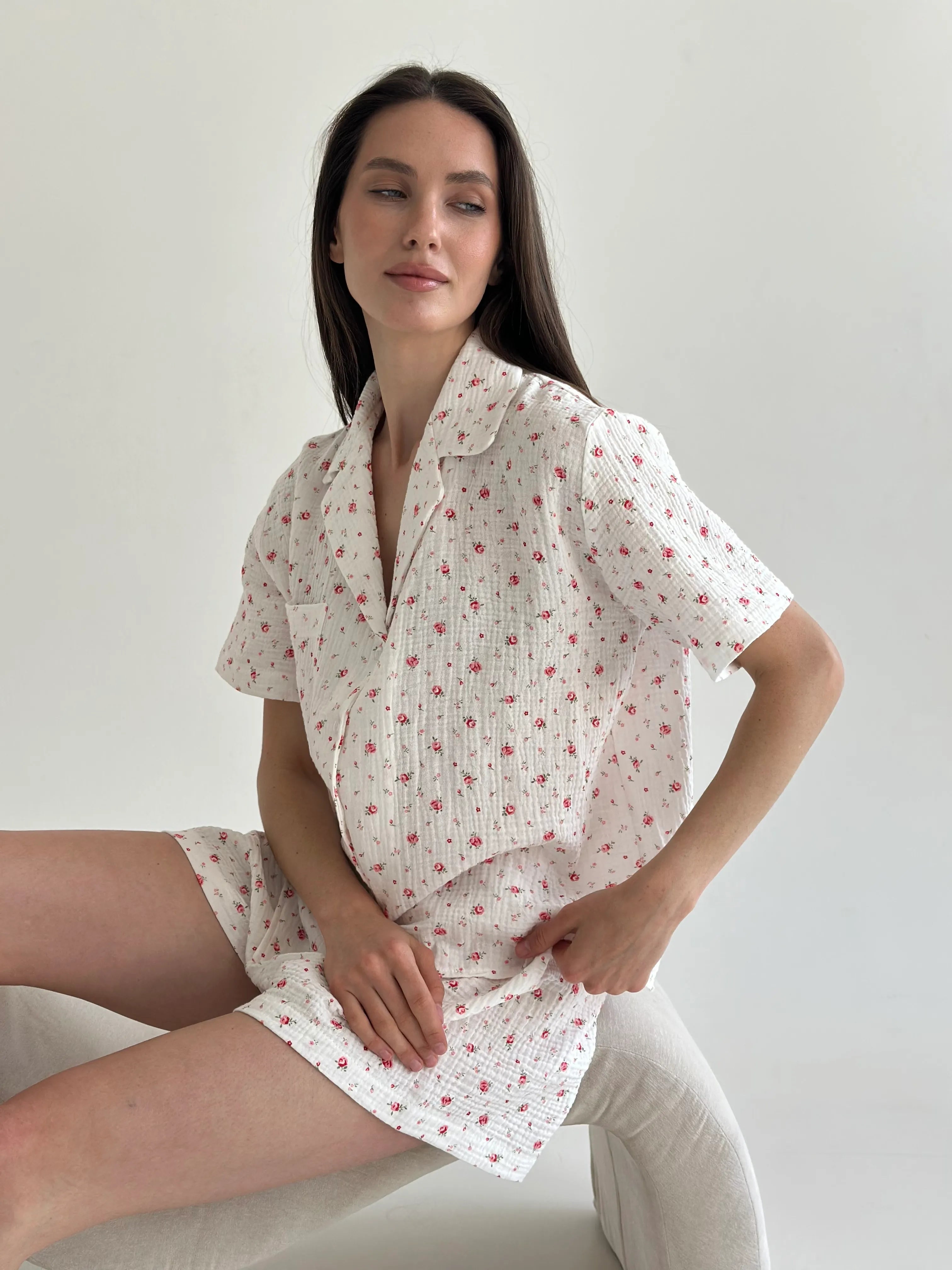Shorts and short-sleeved muslin flower shirt suit on white
