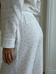 Long sleeve shirt and muslin tulip pants suit on white