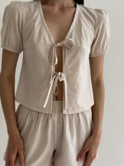 Thin striped cotton suit, bow blouse and beige/milk shorts