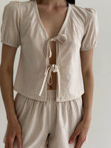Thin striped cotton suit, bow blouse and beige/milk shorts