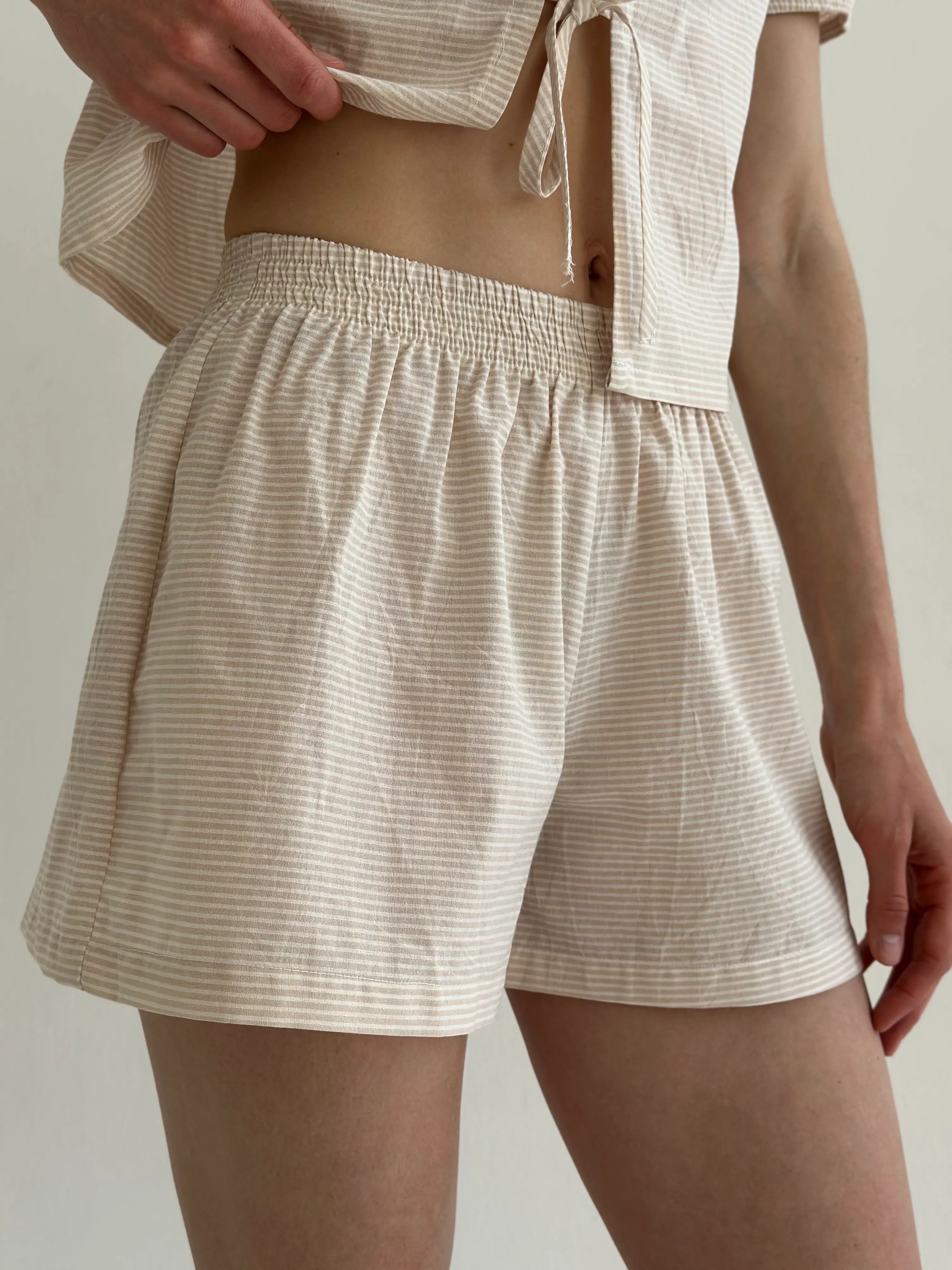 Thin striped cotton suit, bow blouse and beige/milk shorts