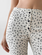 Ribbed milk joggers with a blue flower