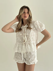 Tie-dye blouse and ruffled shorts suit, cambric flowers, milky