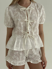 Tie-dye blouse and ruffled shorts suit, cambric flowers, milky