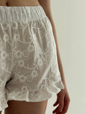 Tie-dye blouse and ruffled shorts suit, cambric flowers, milky