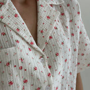 Shorts and short-sleeved muslin flower shirt suit on white